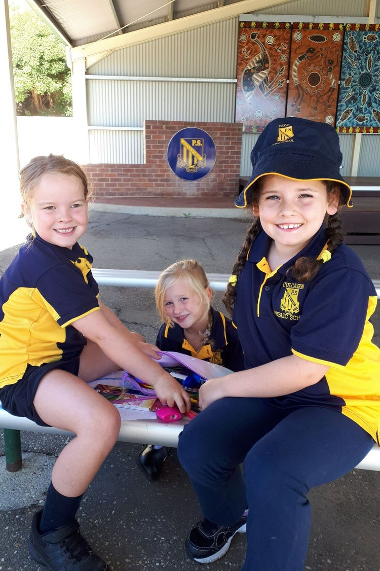 Three students playing under the COLA
