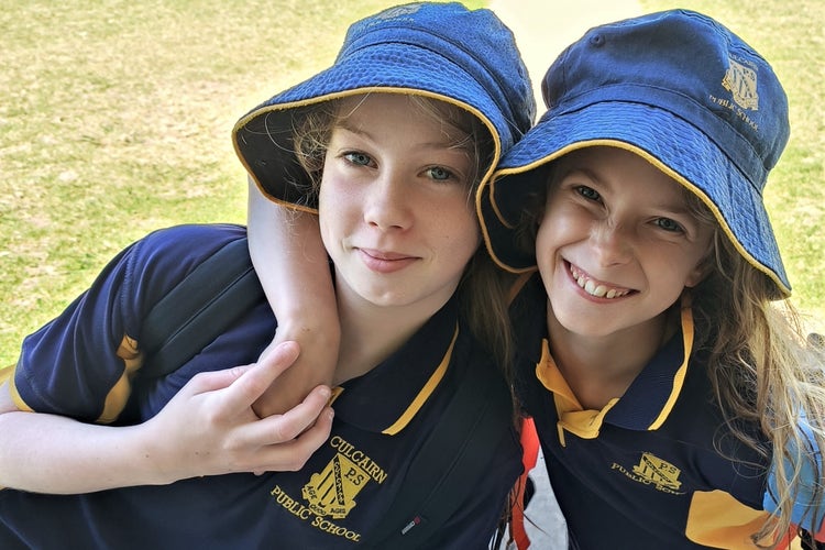 Two students playing happily together