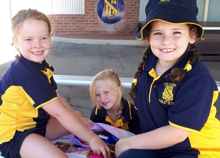 # students playing happily under the COLA